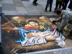 Koln, Germany-A street painter brings colosr to life